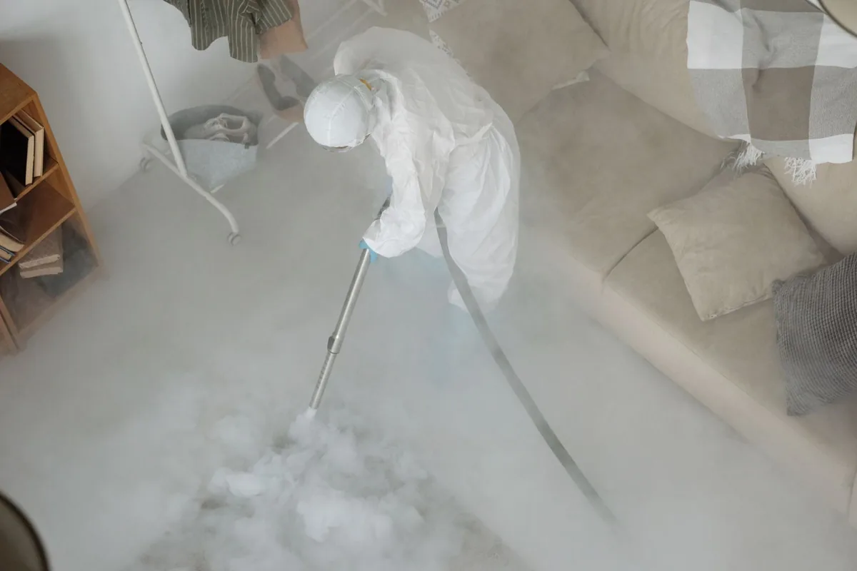 Biohazard cleanup technician in protective equipment, Hartford, KY